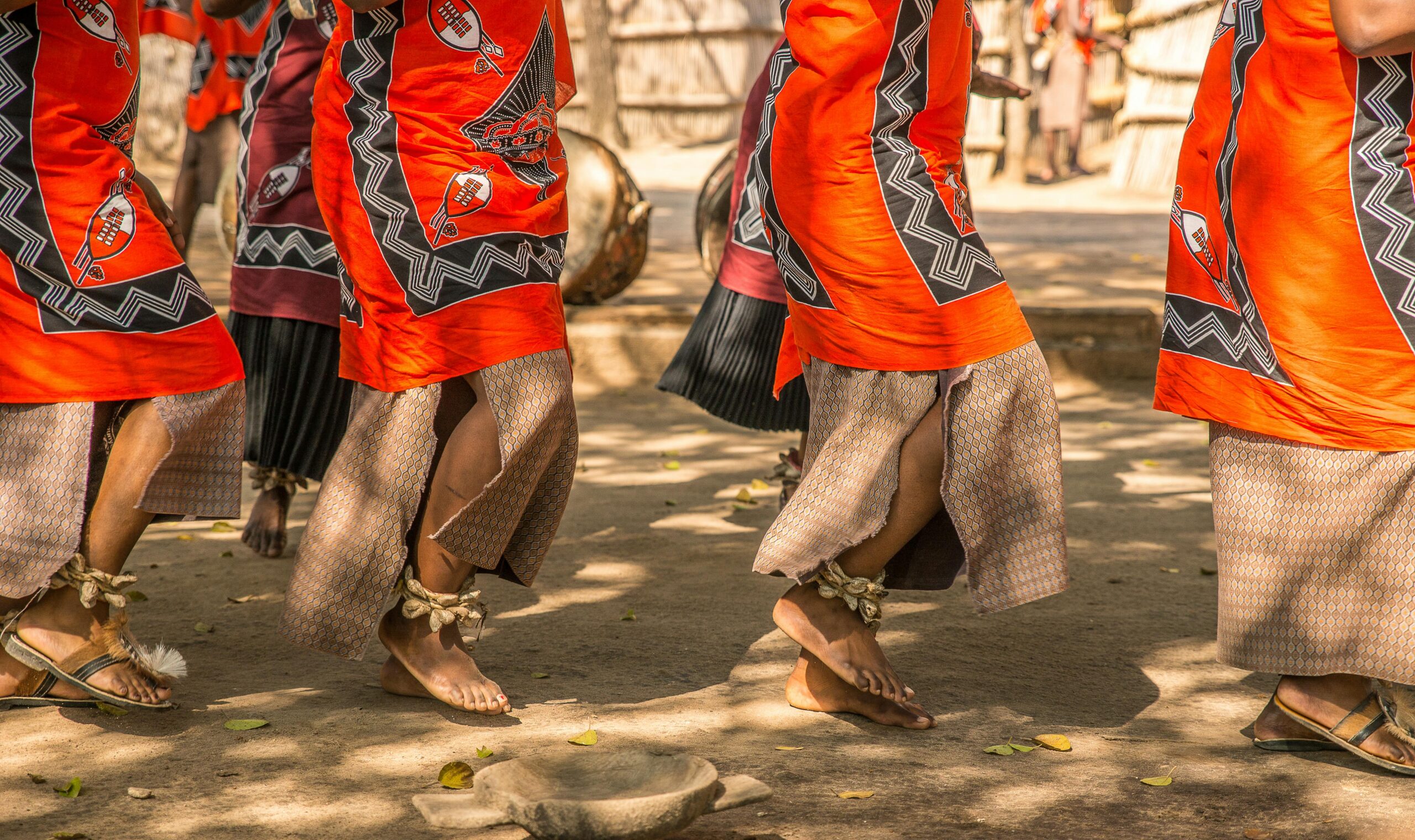 African dancers showcasing ankle beadwork